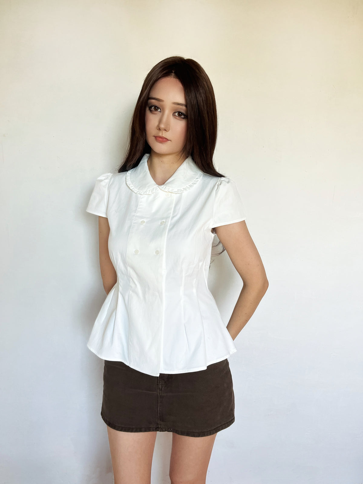Collared peplum blouse in white